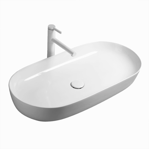 The ceramic washbasin on the bathroom countertop is oval-shaped
